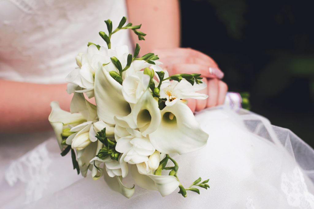 Bride holding a wedding bouquet of calla lilies